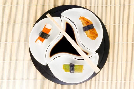 a plate with different kinds of sushi