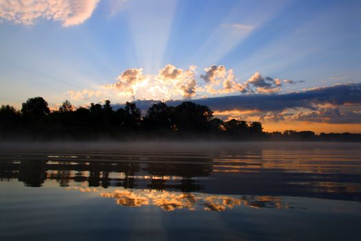 reflection sunrise with clouds on river