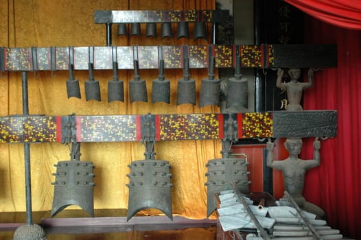 China, Hunan province. Chinese temple, indoor, traditional bells.