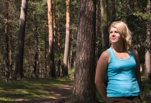 Young beautiful blonde in a forest