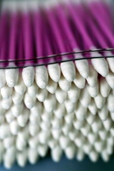 A close up photograph of a pack of cotton buds with purple wands
