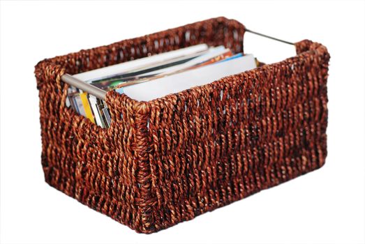 A photograph of a deep brown wicker basket, isolated on white