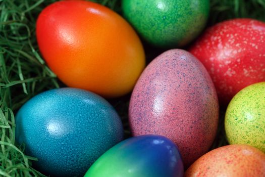 Macro image of painted Easter eggs.  Shallow depth of field focusing on the middle egg.
