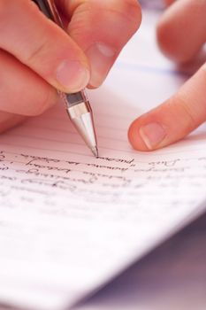 Woman writing letter holding a pen with right hand