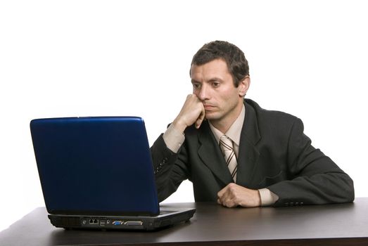 young bored business man working with is laptop