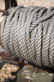 An old winch with some rope on the drum