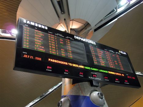 Airport departure board in Kuala Lumpur International Airport, Malaysia