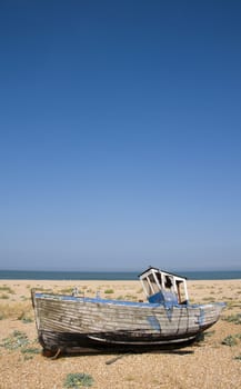 An old fishing boat on the beach at Dungeness