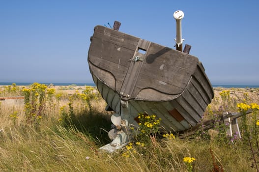 An old fishing boat on the beach at Dungeness