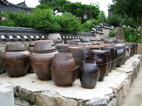 a lot of kimchi pot at the backyard of a heritage house in korea