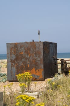 An old abandoned rusty shed on the beach