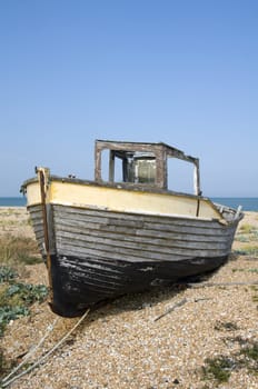 An old fishing boat on the beach at Dungeness