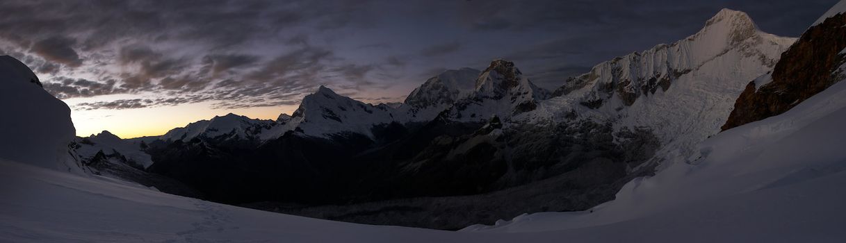 Early morning in glacial circus with dark moraine in the middle, Cordillera Blanca mountains, Peru.