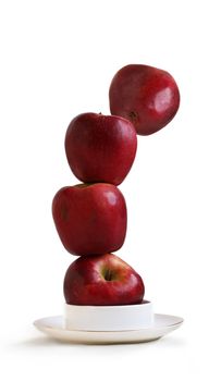 Stack of red apples on a white background 