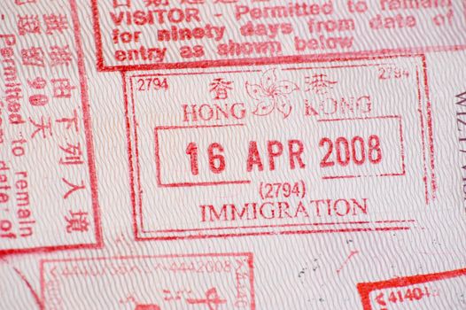 European passport full of stamps from China and Hongkong borders.