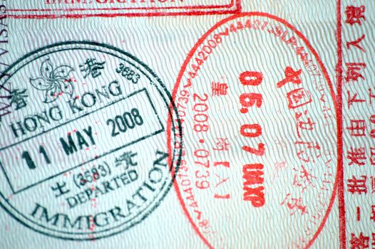 European passport full of stamps from China and Hongkong borders.