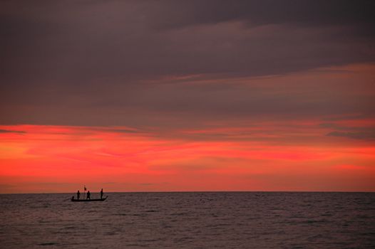 Tailboat on the sea and sunset