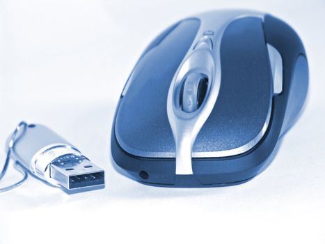 The image of the computer mouse and flash on a homogeneous background