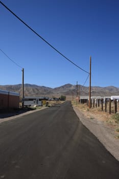 Desert road through an isolated Nevada community.