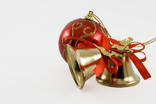 Two handbells and sphere on a white background