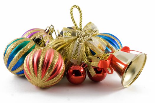 christmas spheres and handbell on a white background