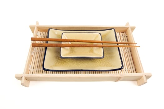 Abstract Chopsticks and Bowls Isolated on a White Background.
