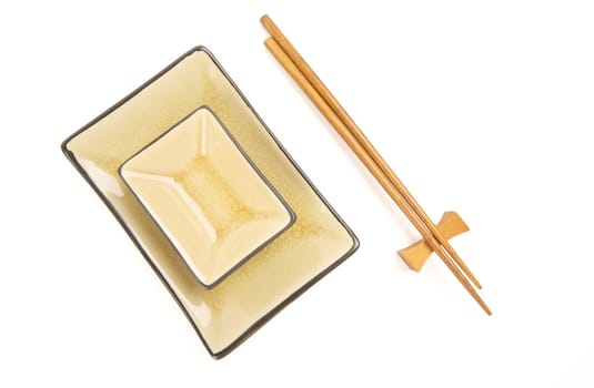 Abstract Chopsticks and Bowls Isolated on a White Background.
