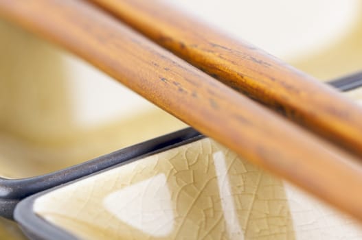 Abstract Chopsticks and Bowls with Narrow Depth of Field.
