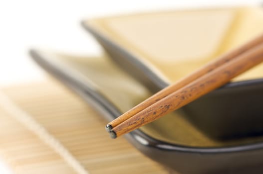 Abstract Chopsticks and Bowls with Narrow Depth of Field.
