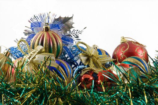 christmas spheres in a tinsel on a white background