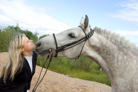 girl with horse.Friendship of an animal and the person