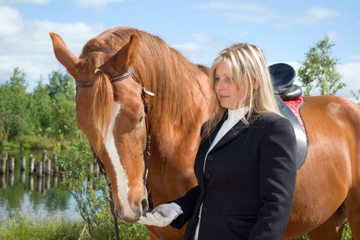 beautiful girl and her handsome horse.Friendship