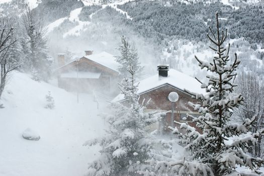 Ski resort at snow storm, Meribel, Trois Vallees, France