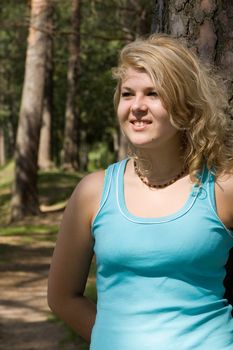 Young beautiful blonde in a forest