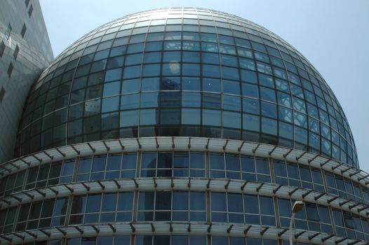 China, Shanghai city. Architecture globe fully covered with glass panels.