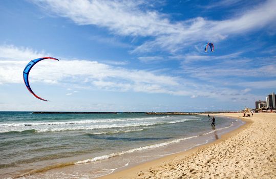 Two kitesurfers on the beach at Tel-Aviv, Israel 