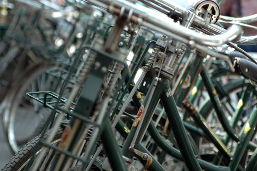 Closeup photo of bikes parked in front of post office in China, Shanghai.