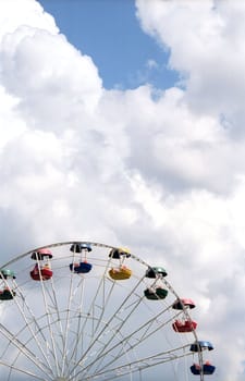 Big dipper with cabins on cloudy sky