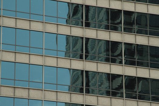 An abstract of a glass wall on a building.