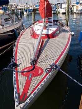 Beautiful modern design wooden yacht in a marina