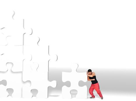 metaphor picture showing a guy moving puzzle pieces, applicable to several concepts