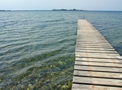 Small old wooden pier jetty Funen Denmark