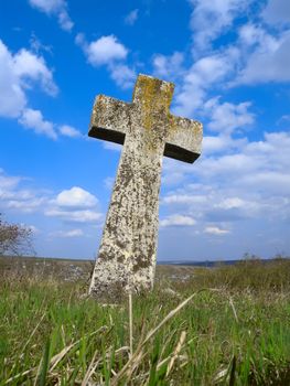 Exalted stone cross in Moldova cemetery