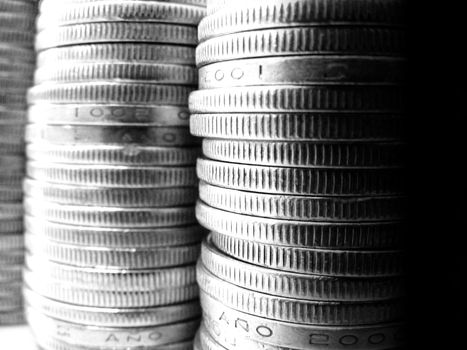 A pile of coins shot on a white background