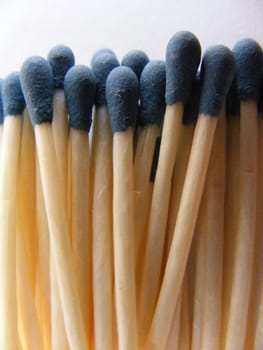 The picture shows a gathering of matches with blue head