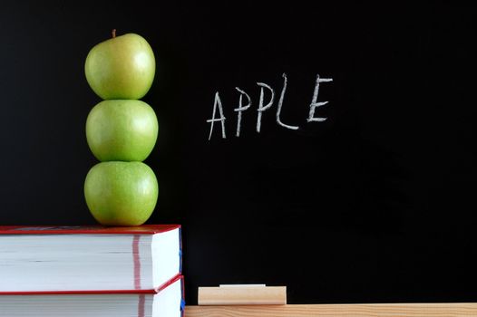 apples books and chalkboard showing healthy lifestyle