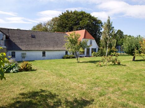 Typical Danish country home with lawn and garden Denmark