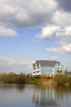 A lake with some wooden clad homes