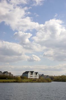 A lake with some wooden clad homes