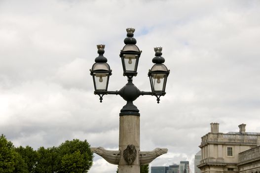 Three victorian lamps on one lamppost